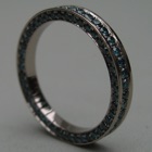 Nr. 18, 750/000 Weißgold, 90/41 Brillanten Petrol/bestrahlt (1,2/1,5 mm, 1,29 ct), Ausgefasst