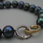 Nr. 31, 750/000 WG/GG,  Brillanten TW/VSI+ / SWZP ( mm, 0,19 ct), Lünette